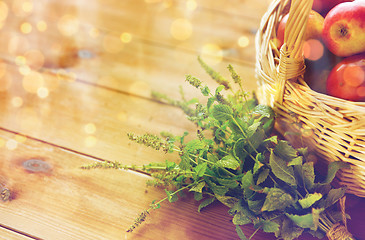 Image showing close up of melissa and basket with apples