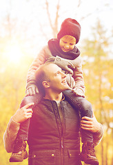 Image showing happy family having fun in autumn park