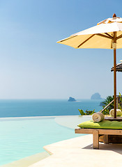 Image showing view from infinity edge pool with parasol to sea