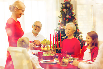 Image showing smiling family having holiday dinner at home