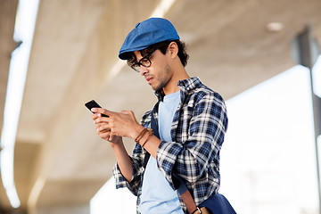 Image showing hipster man texting message on smartphone