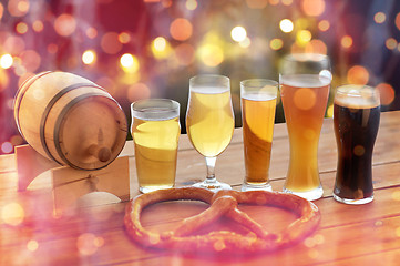 Image showing close up of beer glasses, barrel and pretzel