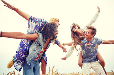 Image showing happy hippie friends having fun on cereal field