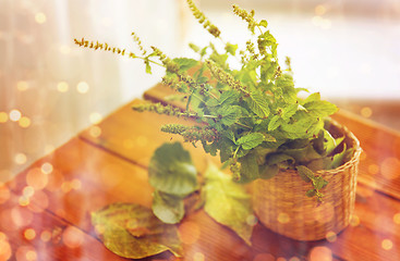 Image showing close up of melissa in basket on wooden table