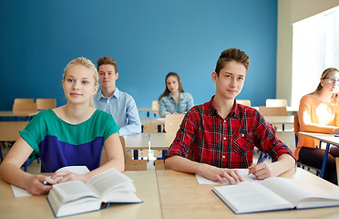 Image showing group of students with books at school lesson