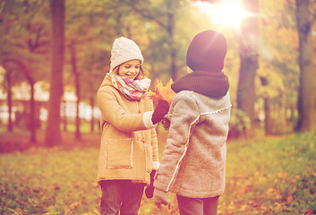 Image showing smiling children in autumn park