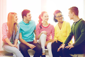 Image showing five smiling teenagers having fun at home