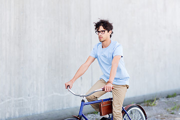 Image showing young hipster man riding fixed gear bike