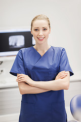 Image showing happy female dentist at dental clinic office