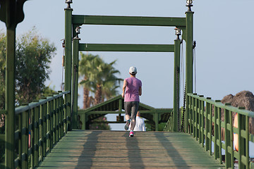 Image showing sporty woman jogging