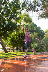 Image showing sporty woman jogging