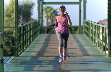 Image showing sporty woman jogging