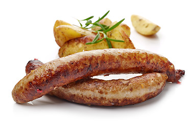 Image showing grilled sausages and potatoes