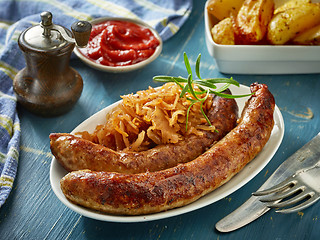 Image showing grilled sausages with sauerkraut