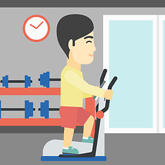 Image showing Man exercising on elliptical trainer.