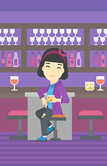 Image showing Woman sitting at the bar counter.