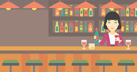 Image showing Bartender standing at the bar counter.