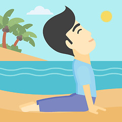Image showing Man practicing yoga upward dog pose on the beach.