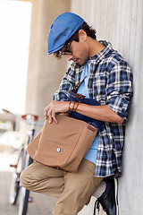 Image showing hipster man with shoulder bag and fixed gear bike