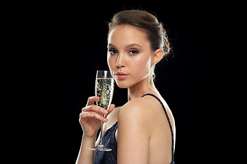 Image showing young asian woman drinking champagne at party