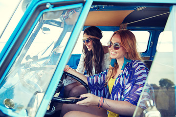 Image showing smiling young hippie women driving minivan car