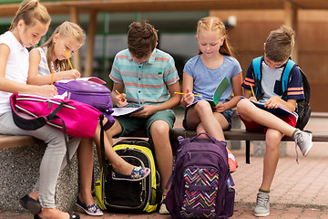 Image showing group of happy elementary school students outdoors