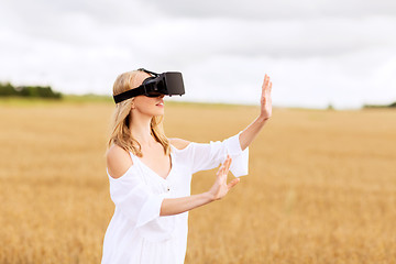 Image showing woman in virtual reality headset on cereal field