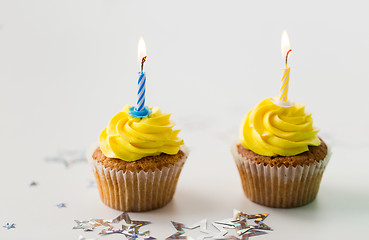 Image showing birthday cupcakes with burning candles