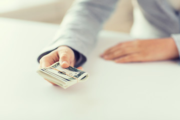 Image showing close up of woman hands holding us dollar money