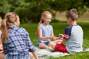 Image showing happy kids playing rock-paper-scissors game