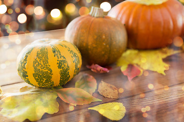 Image showing close up of halloween pumpkins on wooden table