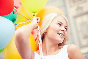 Image showing woman with colorful balloons