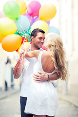 Image showing couple with colorful balloons