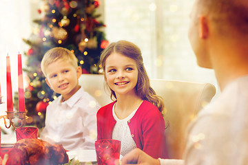 Image showing smiling family having holiday dinner at home