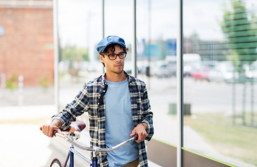 Image showing hipster man walking with fixed gear bike