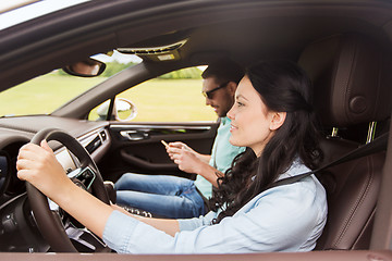 Image showing happy man and woman driving in car