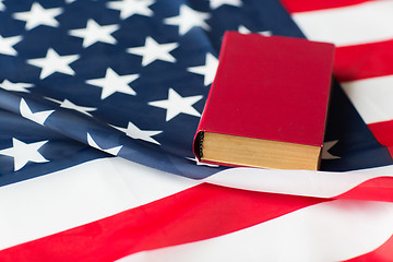 Image showing close up of american flag and book