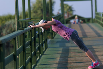 Image showing woman  stretching before morning jogging