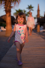 Image showing girl and mother walking