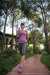 Image showing sporty woman jogging