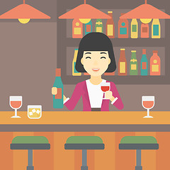 Image showing Bartender standing at the bar counter.