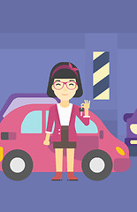 Image showing Woman holding keys to her new car.