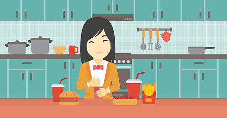 Image showing Satisfied woman eating fast food.