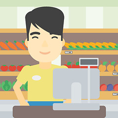 Image showing Cashier standing at the checkout in supermarket.