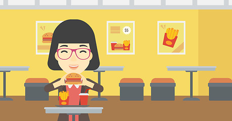 Image showing Woman eating hamburger vector illustration.