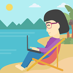 Image showing Business woman working on laptop on the beach.