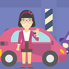 Image showing Woman holding keys to her new car.