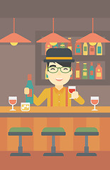 Image showing Bartender standing at the bar counter.