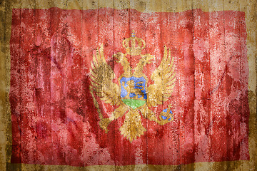 Image showing Grunge style of Montenegro flag on a brick wall     
