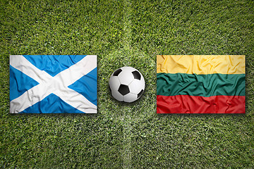 Image showing Scotland and Lithuania flags on soccer field